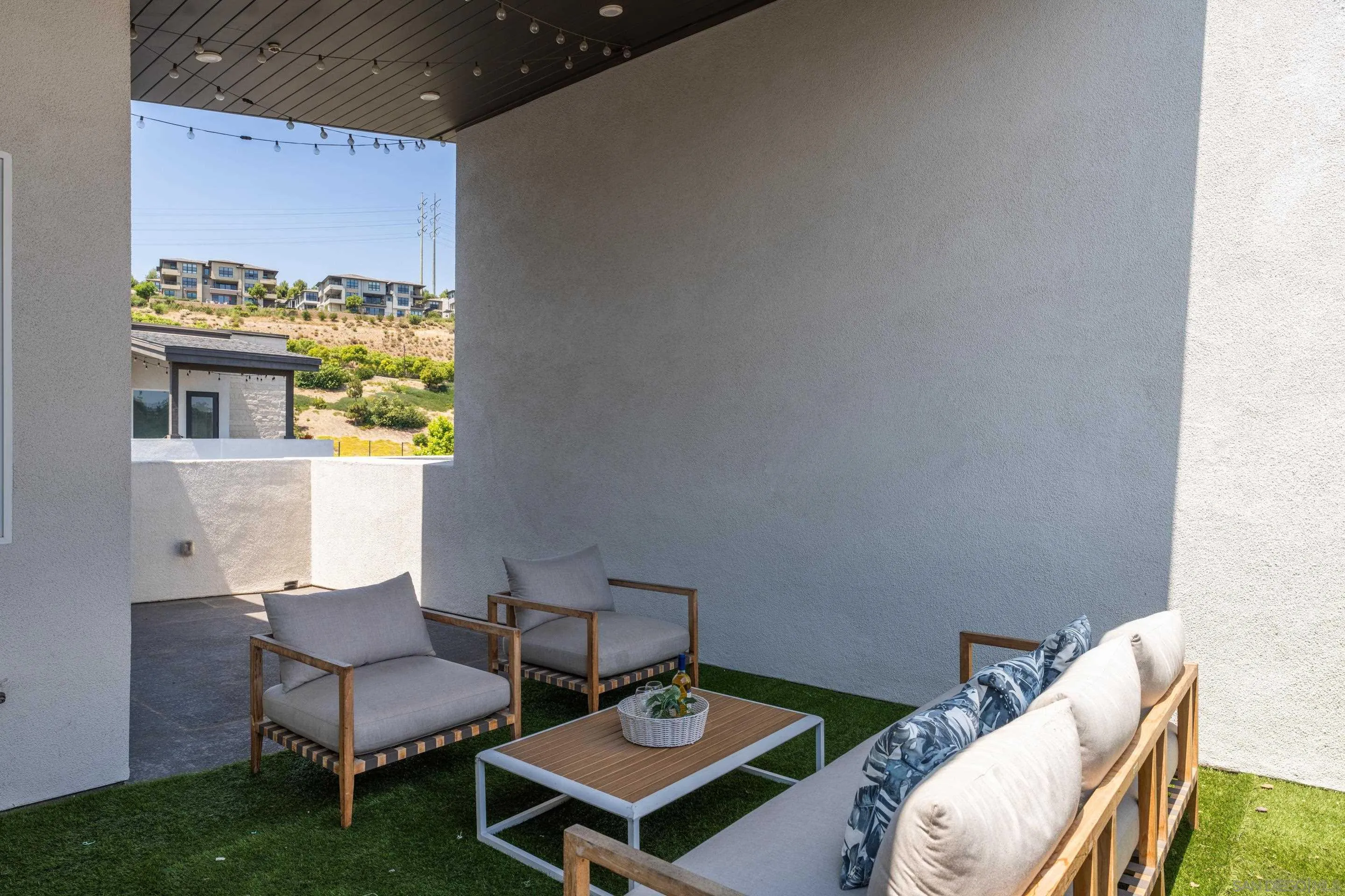 2731 Via Avella San Diego, CA 92108 - Photo 19 of 39 a living room with furniture and a table