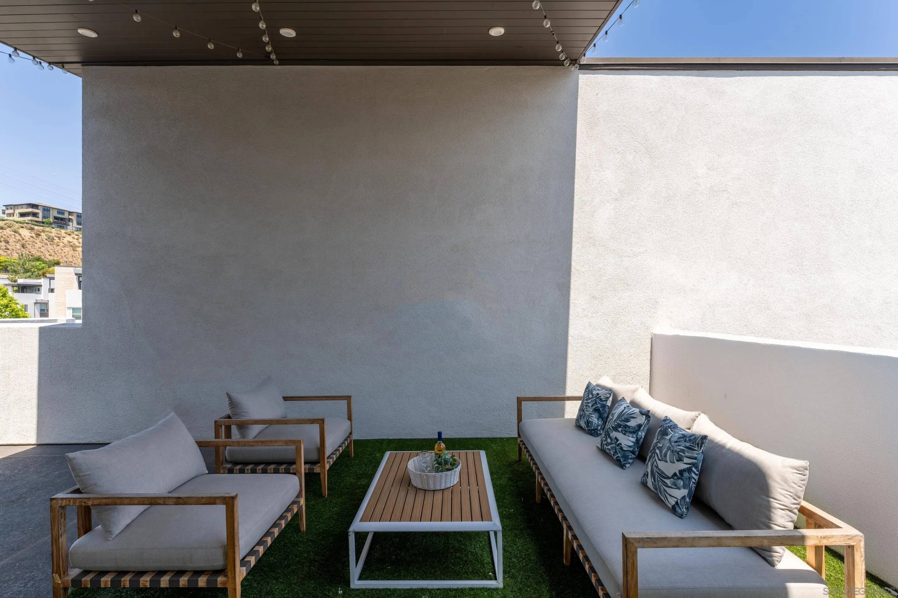2731 Via Avella San Diego, CA 92108 - Photo 20 of 39 view of living room with furniture and a window