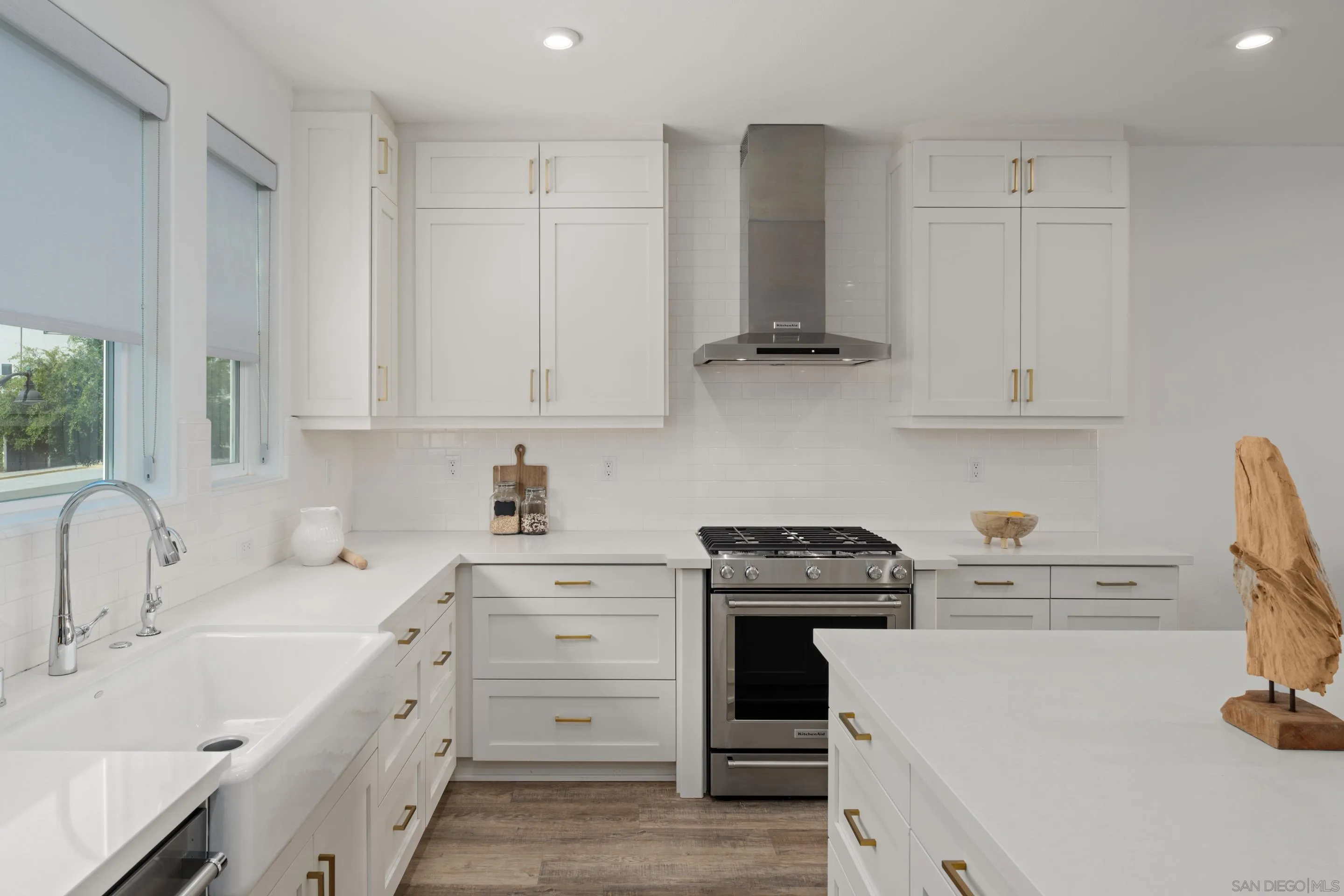 2731 Via Avella San Diego, CA 92108 - Photo 2 of 39 a kitchen with sink a stove and cabinets