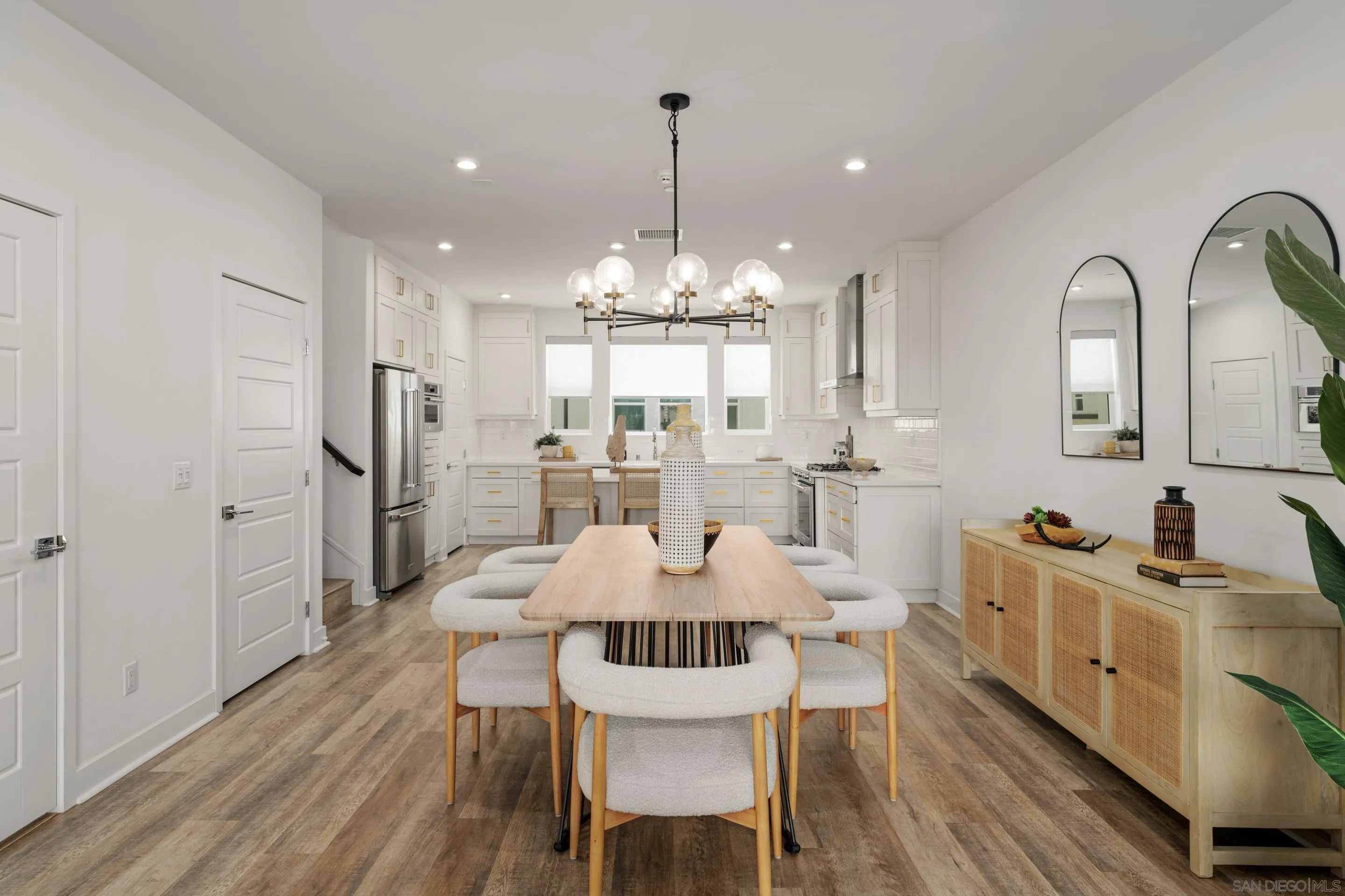 2731 Via Avella San Diego, CA 92108 - Photo 7 of 39 a view of a dining room with furniture window and wooden floor