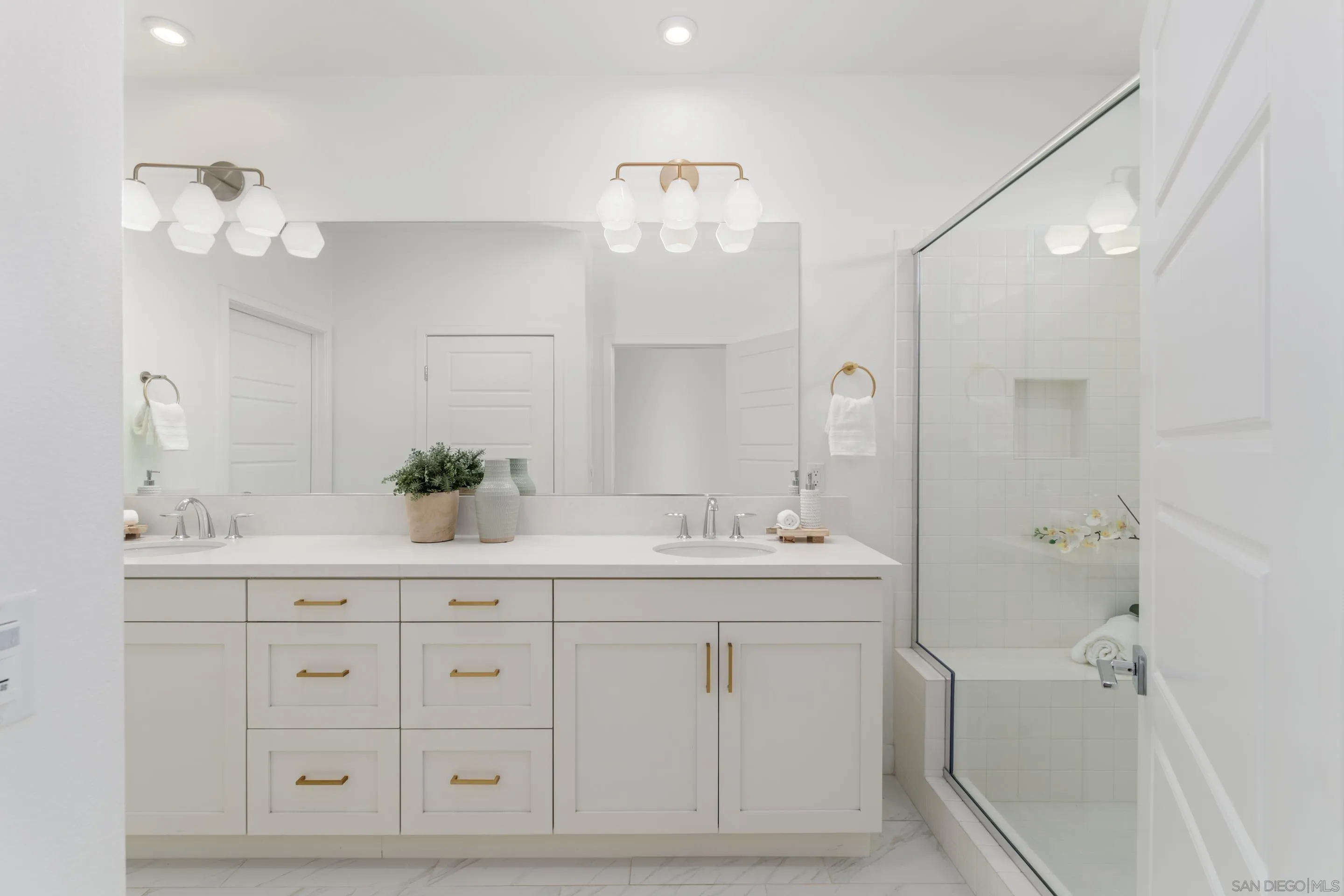 2731 Via Avella San Diego, CA 92108 - Photo 9 of 39 a spacious bathroom with a double vanity sink mirror and bathtub