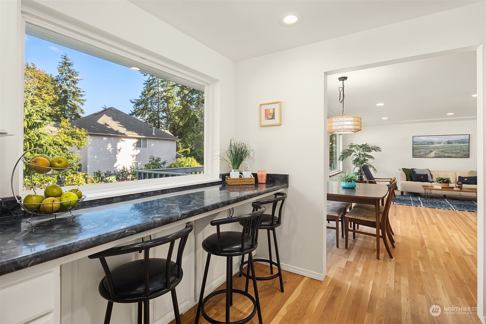 1834 North 183rd Street Shoreline, WA 98133 - Photo 16 of 40 a view of a dining room with furniture window and wooden floor