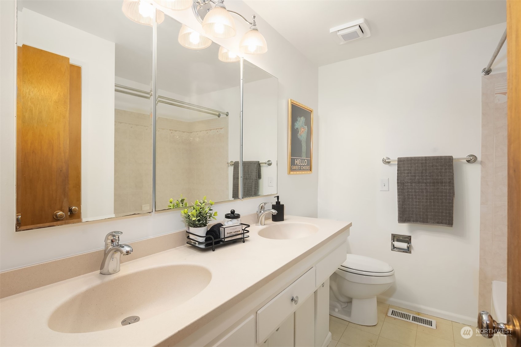 1834 North 183rd Street Shoreline, WA 98133 - Photo 17 of 40 a bathroom with a toilet sink and mirror