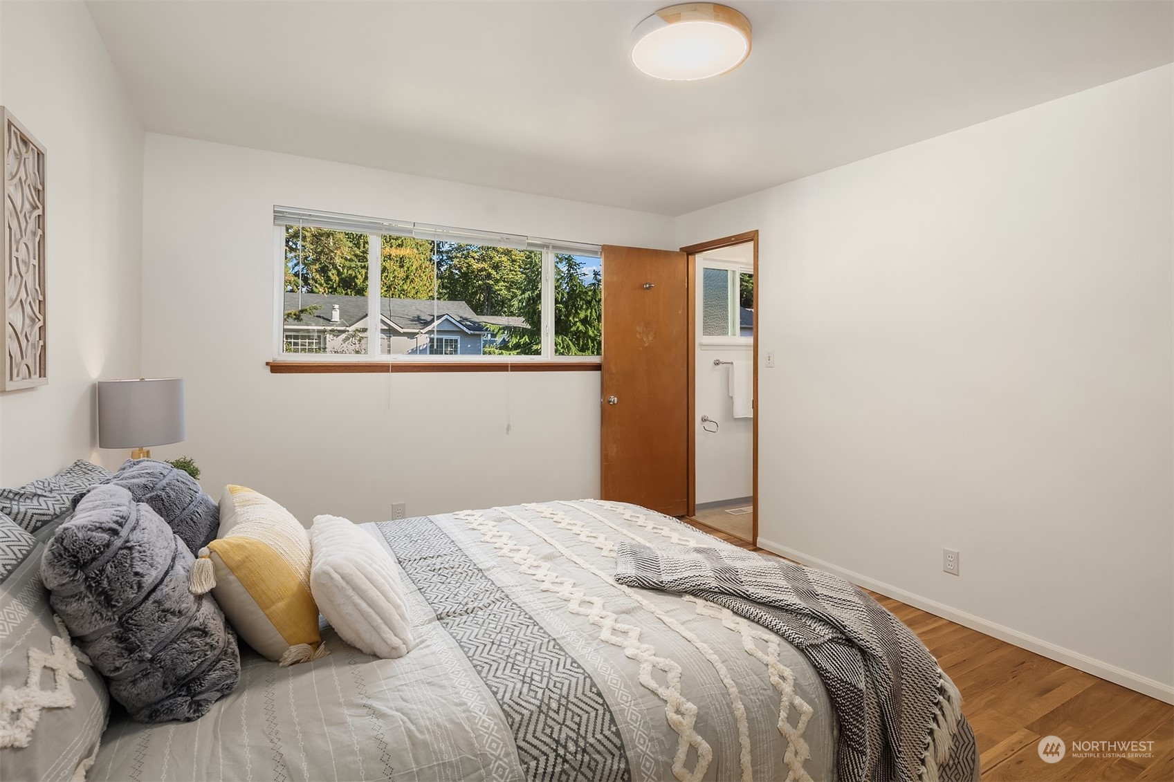 1834 North 183rd Street Shoreline, WA 98133 - Photo 19 of 40 a bedroom with a bed and window