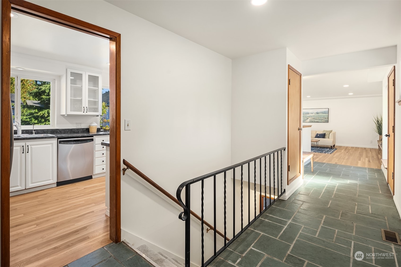 1834 North 183rd Street Shoreline, WA 98133 - Photo 4 of 40 a view of a hallway with wooden floor and staircase