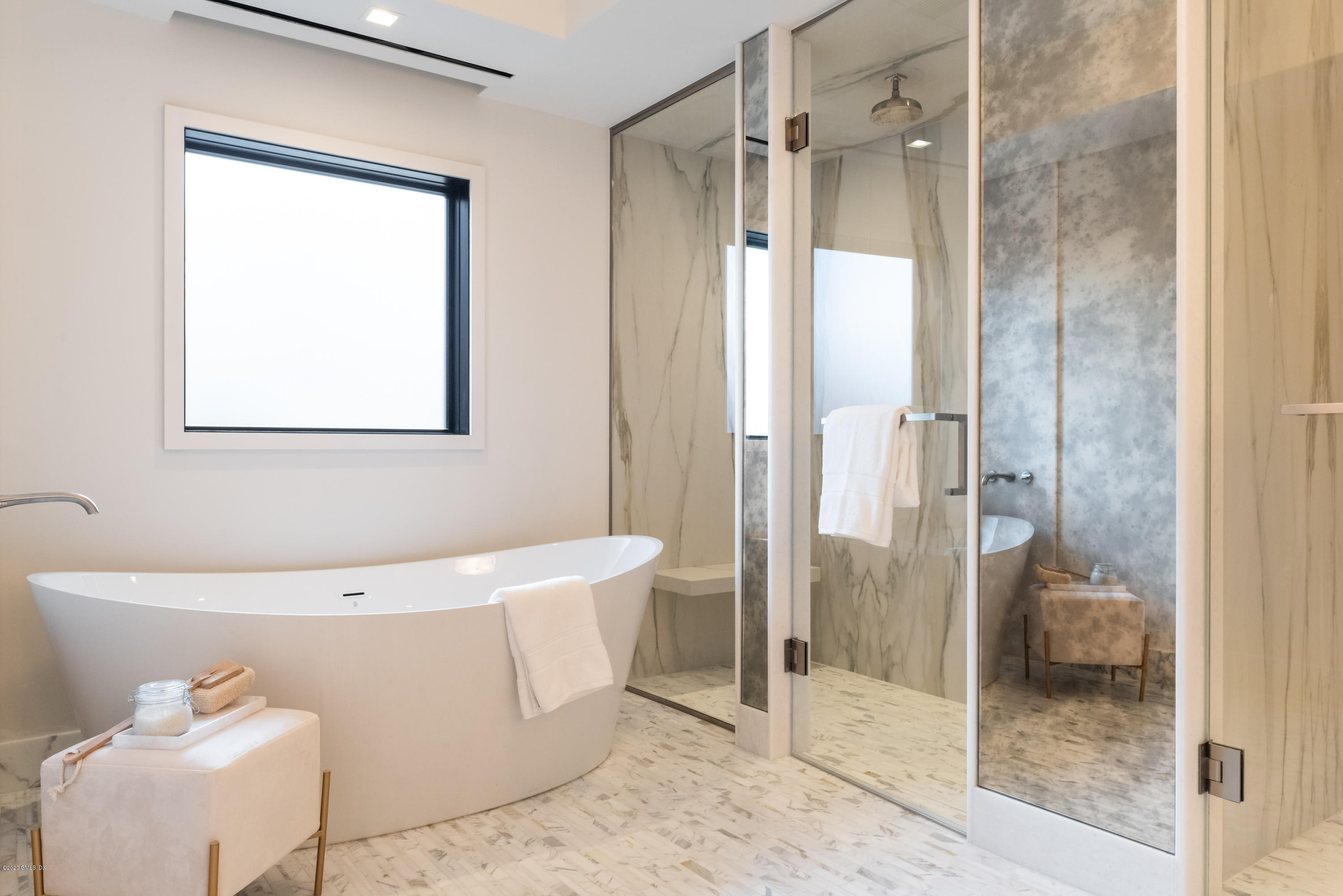 125 Field Point Road, Unit 1A Greenwich, CT 06830 - Photo 12 of 25 a bathroom with a bathtub and a shower