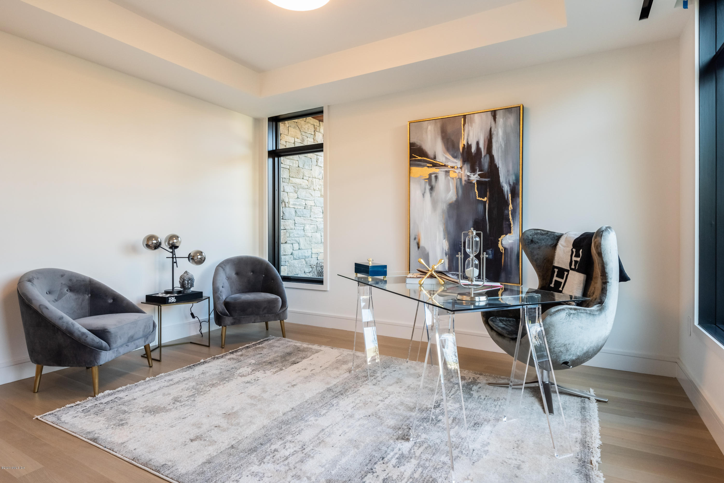 125 Field Point Road, Unit 1A Greenwich, CT 06830 - Photo 17 of 25 a view of a workspace with furniture and lounge chair