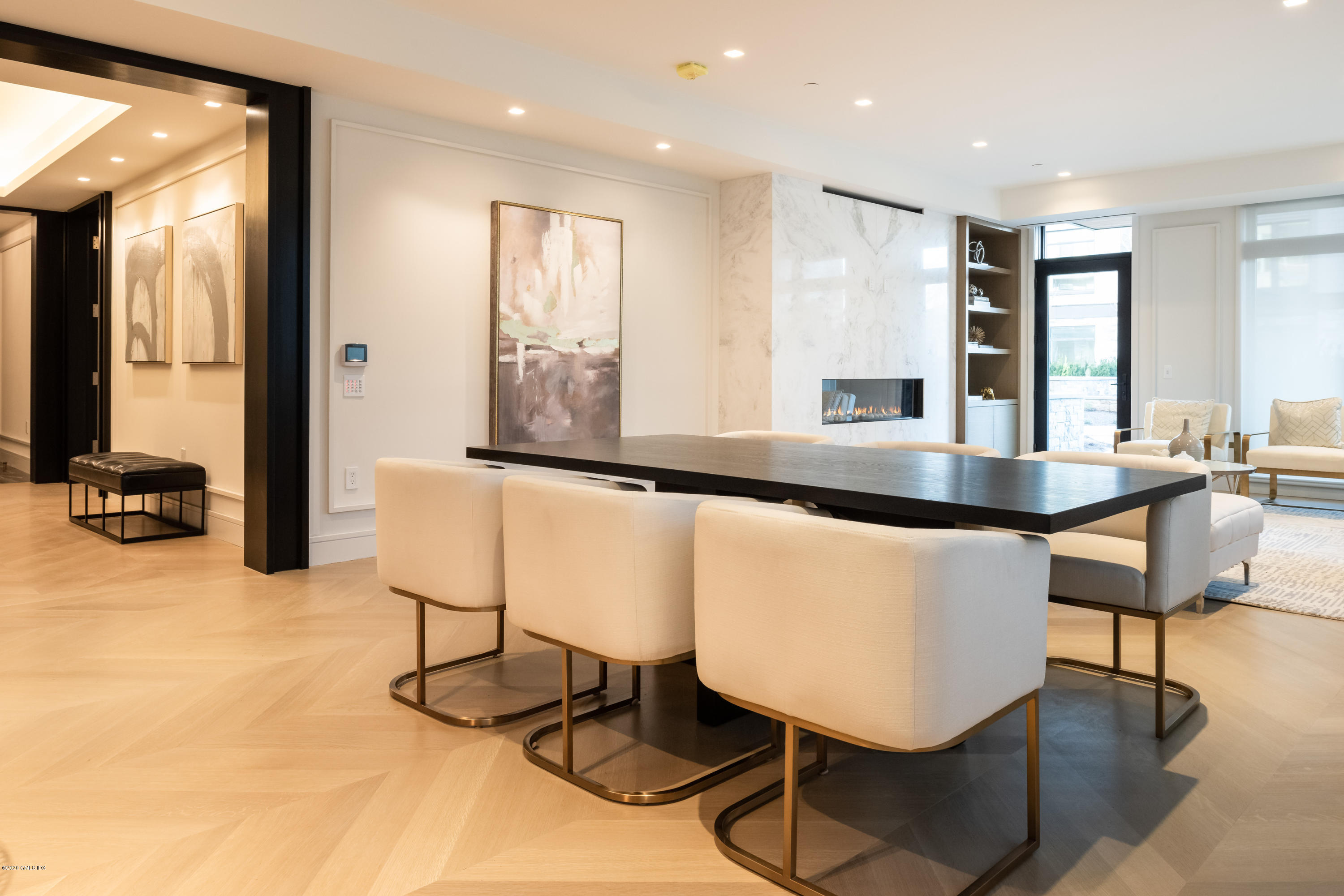 125 Field Point Road, Unit 1A Greenwich, CT 06830 - Photo 5 of 25 a view of kitchen island with furniture and living room