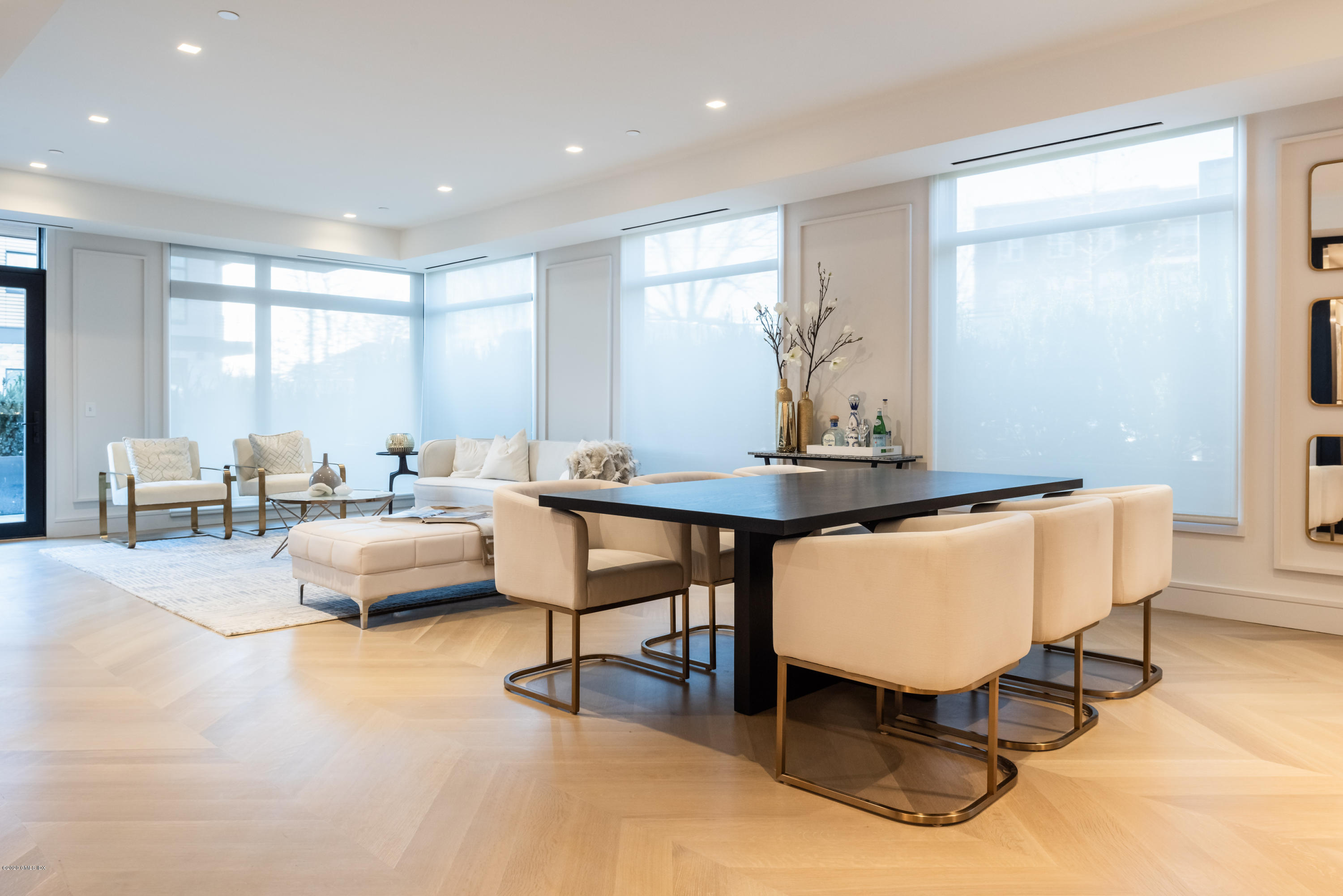 125 Field Point Road, Unit 1A Greenwich, CT 06830 - Photo 6 of 25 a living room with furniture and a table