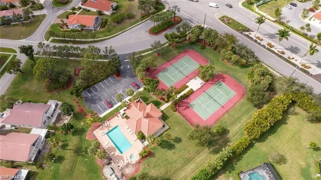 an aerial view of residential house with outdoor space and lake view