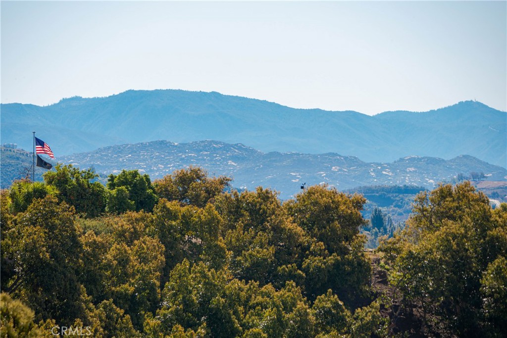 22103 Carancho Road Temecula, CA 92590 - Photo 14 of 27 a view of a house with a mountain and mountains in the background