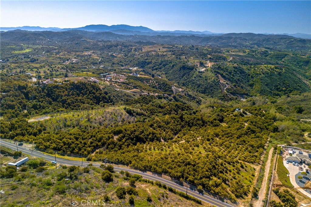 22103 Carancho Road Temecula, CA 92590 - Photo 23 of 27 a view of a lush green hillside and houses
