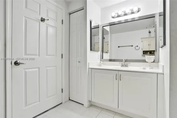 a bathroom with a sink and a mirror
