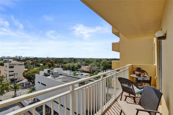 a view of a balcony with chairs