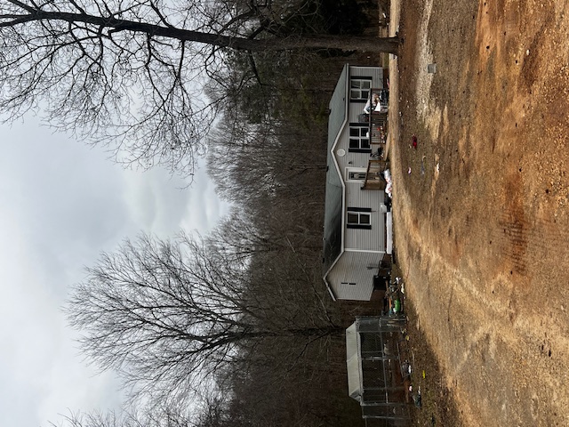 A charming residence set against a natural backdrop.