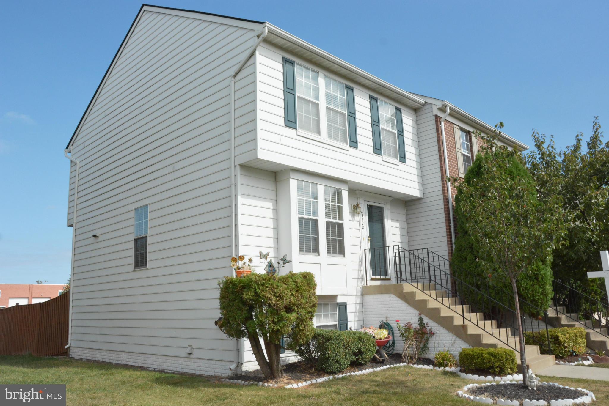 45322 Gable Square Sterling, VA 20164 - Photo 2 of 30 a front view of a house with a yard
