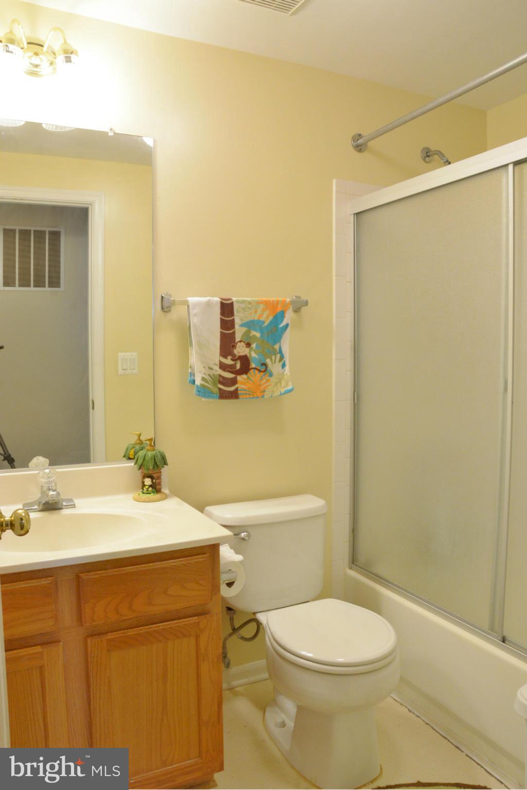 45322 Gable Square Sterling, VA 20164 - Photo 14 of 30 a bathroom with a sink a toilet and shower