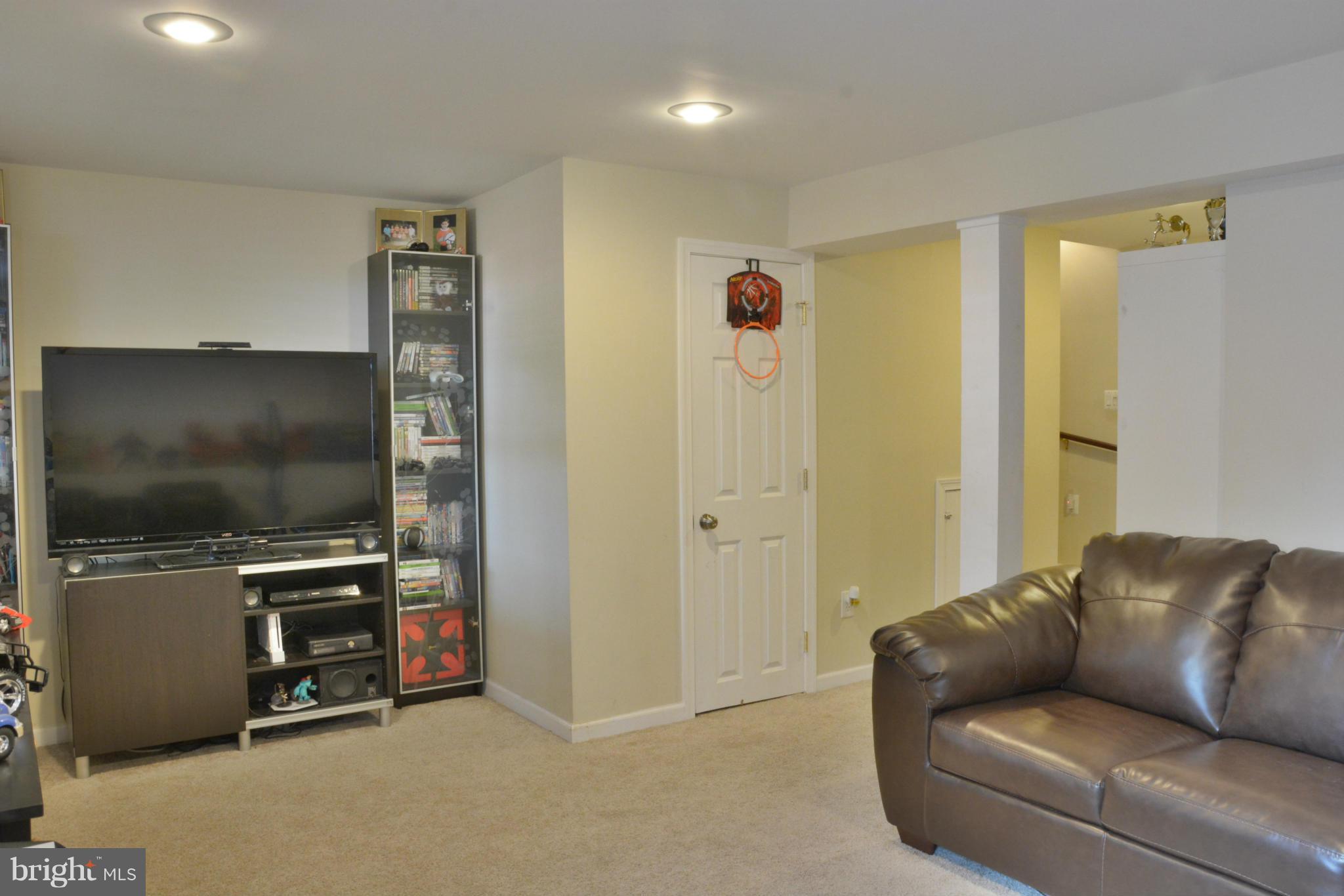 45322 Gable Square Sterling, VA 20164 - Photo 21 of 30 a living room with furniture and a flat screen tv