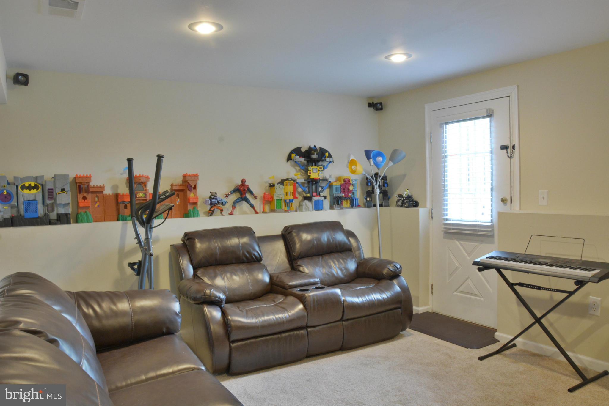 45322 Gable Square Sterling, VA 20164 - Photo 26 of 30 a projector room with a couch and a window