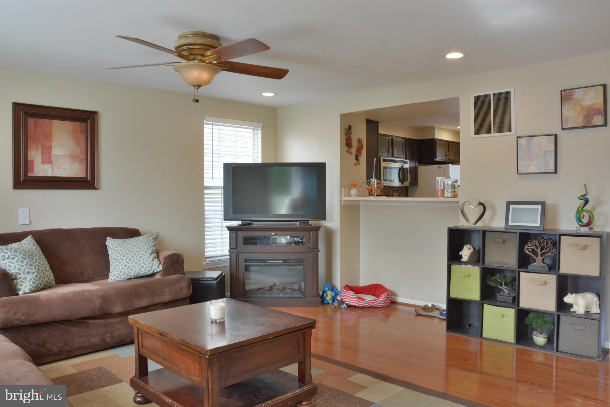 45322 Gable Square Sterling, VA 20164 - Photo 6 of 30 a living room with furniture and a flat screen tv