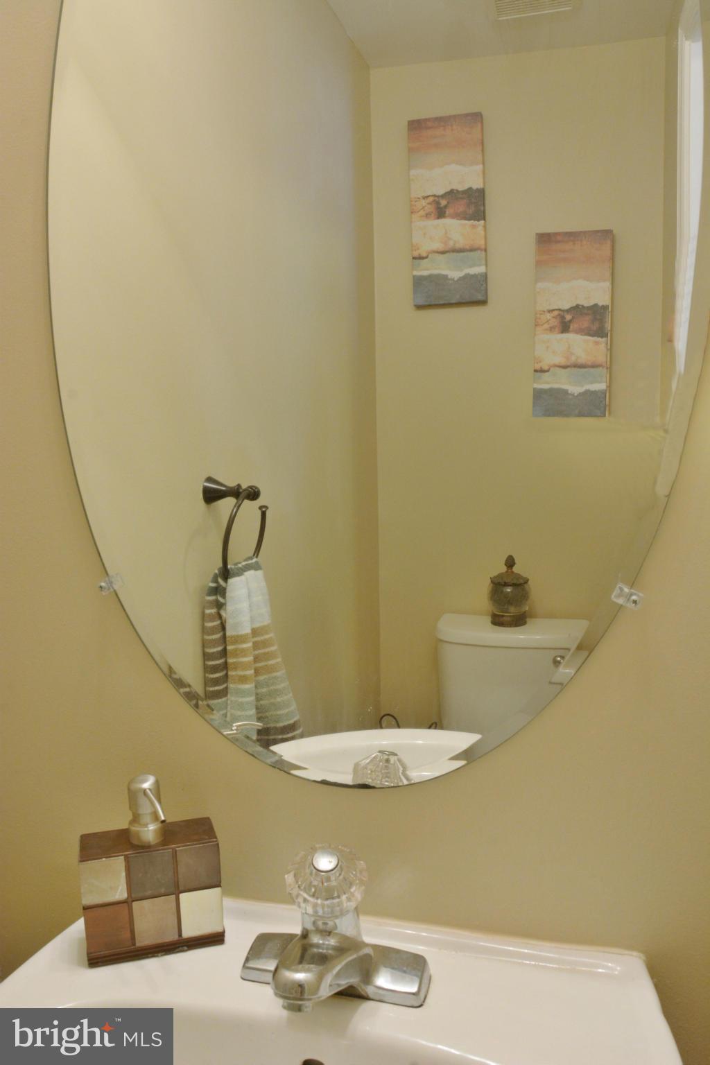 45322 Gable Square Sterling, VA 20164 - Photo 9 of 30 a bathroom with a sink and a mirror