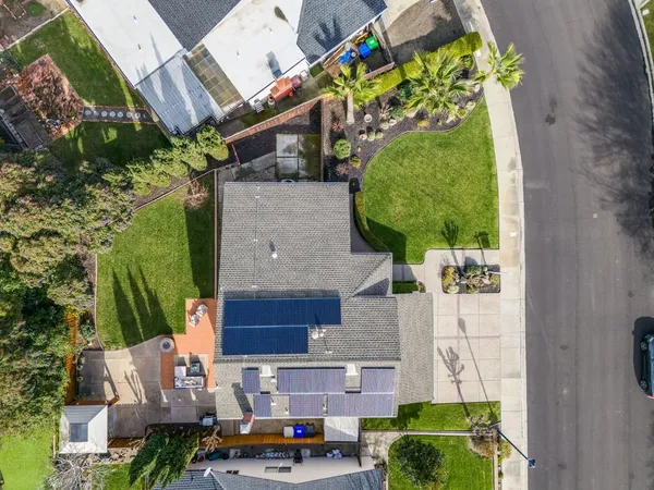 an aerial view of a house with a garden and plants