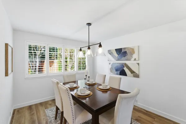 a view of a dining room with furniture window and outside view