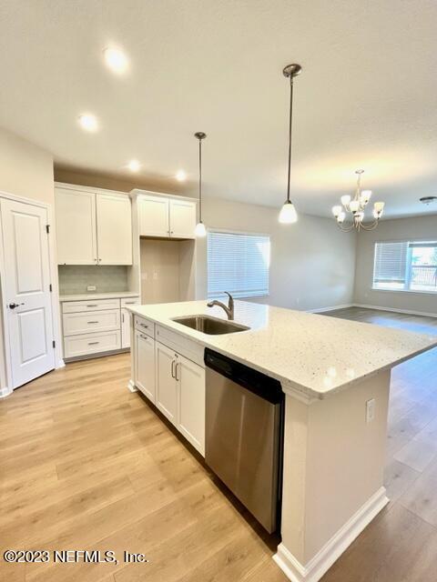 3796 Eagle Rock Road Middleburg, FL 32068 - Photo 3 of 7 a large kitchen with kitchen island a sink stainless steel appliances and cabinets