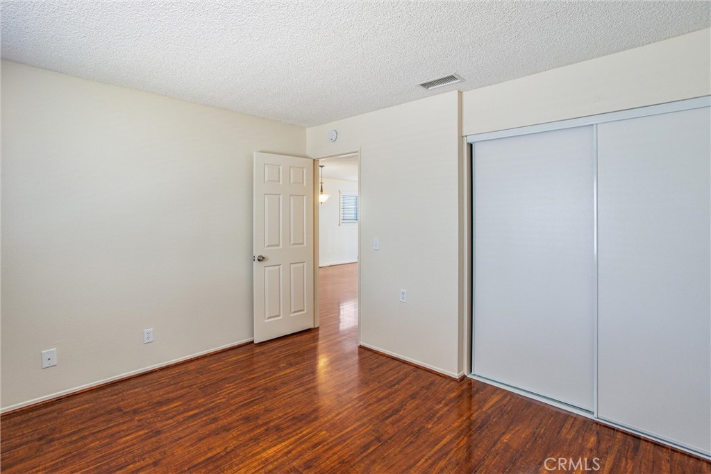 29252 Murrieta Road Menifee, CA 92586 - Photo 17 of 28 a view of an empty room with wooden floor