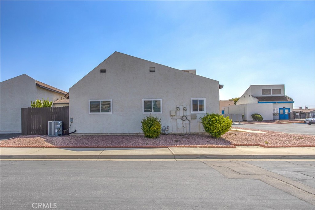 29252 Murrieta Road Menifee, CA 92586 - Photo 26 of 28 front view of a house with a street