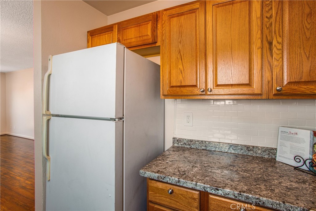 29252 Murrieta Road Menifee, CA 92586 - Photo 5 of 28 a white refrigerator freezer sitting in a kitchen