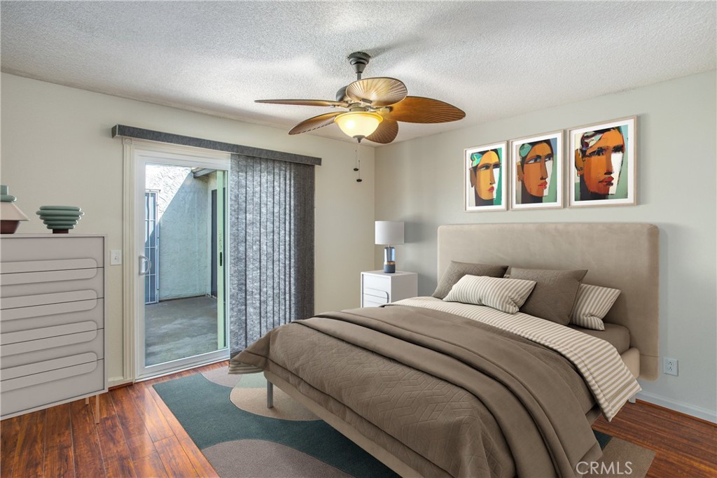 29252 Murrieta Road Menifee, CA 92586 - Photo 7 of 28 a bedroom with a bed and a chandelier