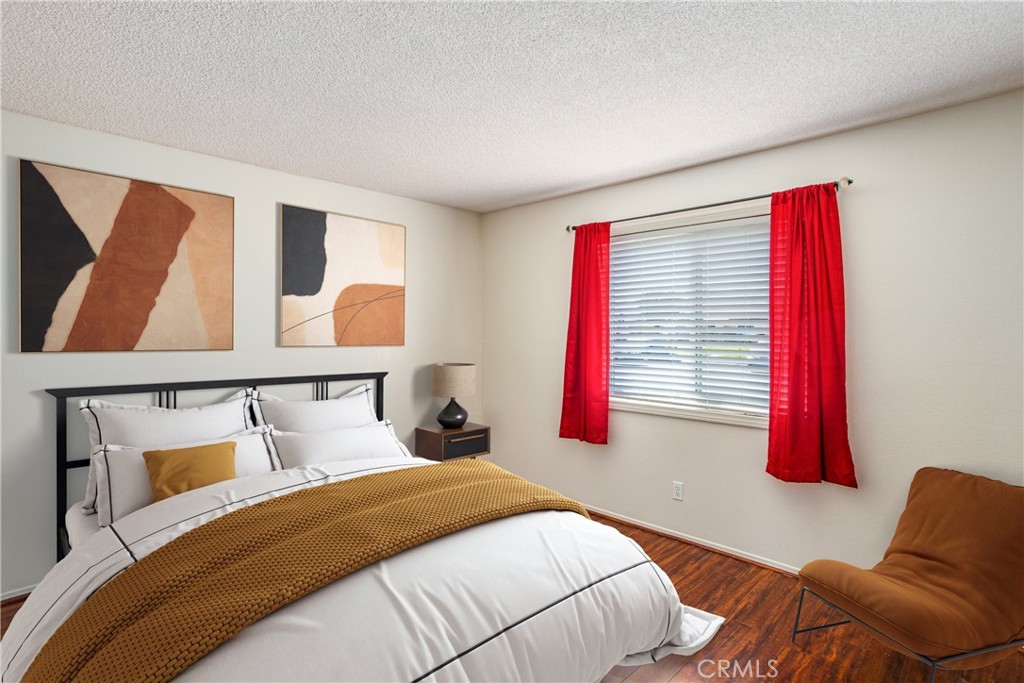 29252 Murrieta Road Menifee, CA 92586 - Photo 8 of 28 a bedroom with a bed and wooden floor