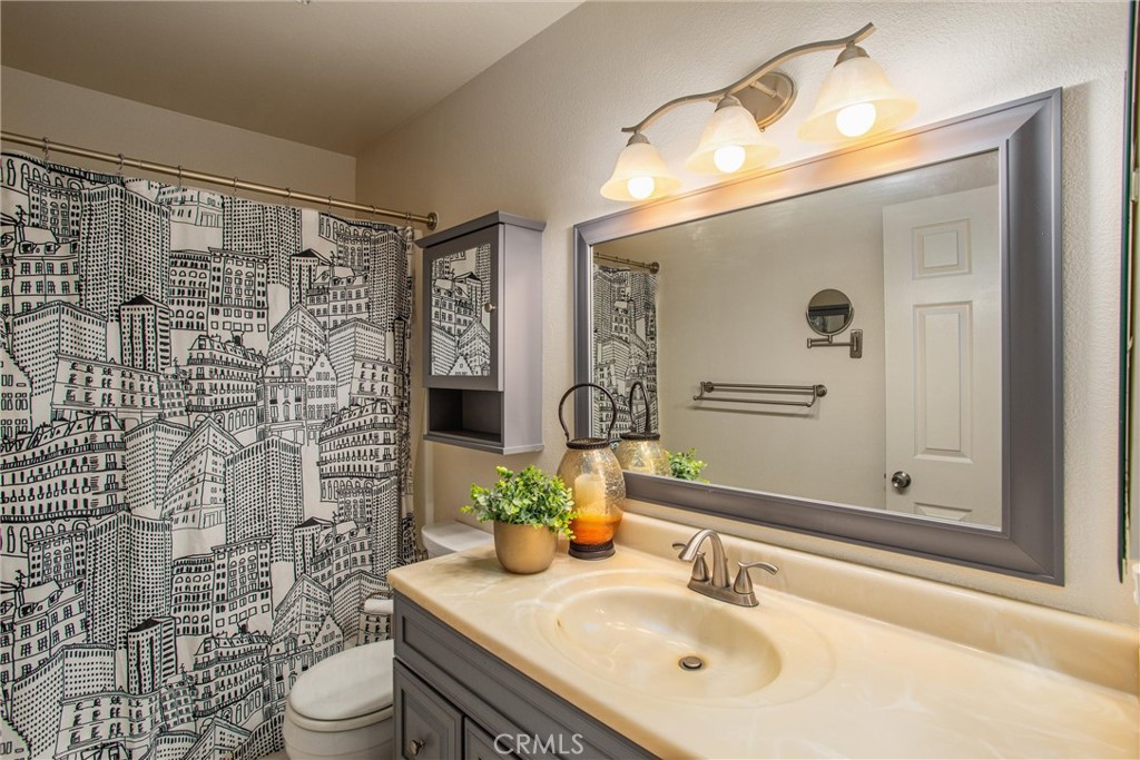 29252 Murrieta Road Menifee, CA 92586 - Photo 9 of 28 a bathroom with a sink vanity granite toilet and shower