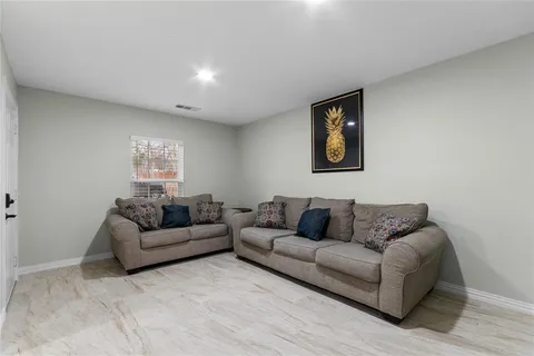 a living room with furniture and a couch