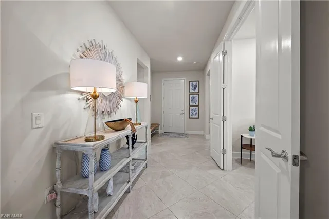 a view of an entryway with workspace and bedroom