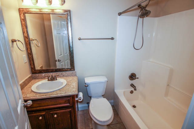 195 McLendon Road Fort Mitchell, AL 36856 - Photo 11 of 15 a bathroom with a granite countertop sink toilet and shower a mirror
