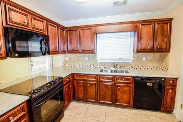 195 McLendon Road Fort Mitchell, AL 36856 - Photo 7 of 15 a kitchen with a sink a stove and cabinets