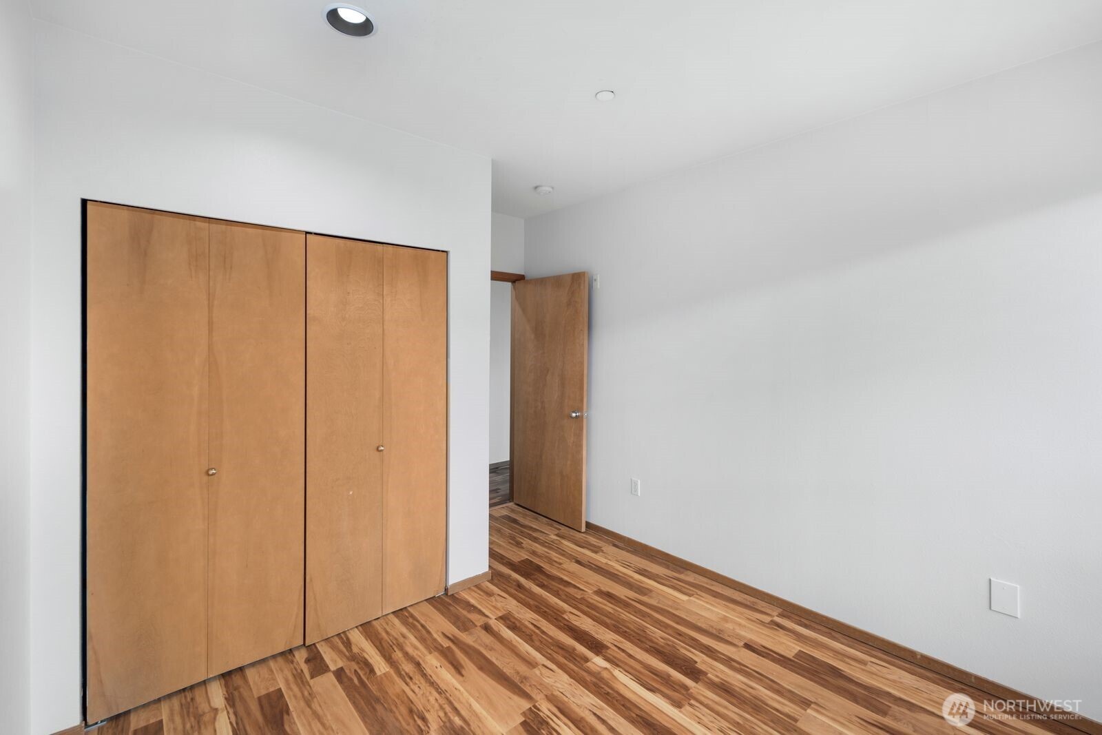 668 South Lane Street, Unit 314 Seattle, WA 98104 - Photo 17 of 36 a view of a room with wooden floor and bench