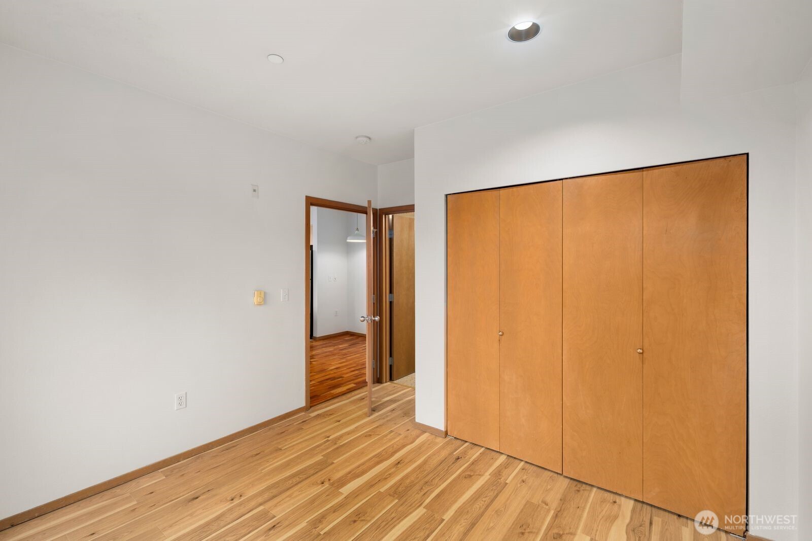 668 South Lane Street, Unit 314 Seattle, WA 98104 - Photo 20 of 36 a view of an empty room with wooden floor and a window