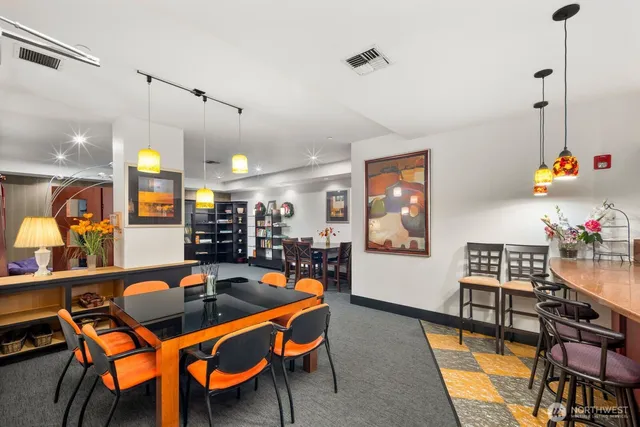 a room with furniture and gym equipment