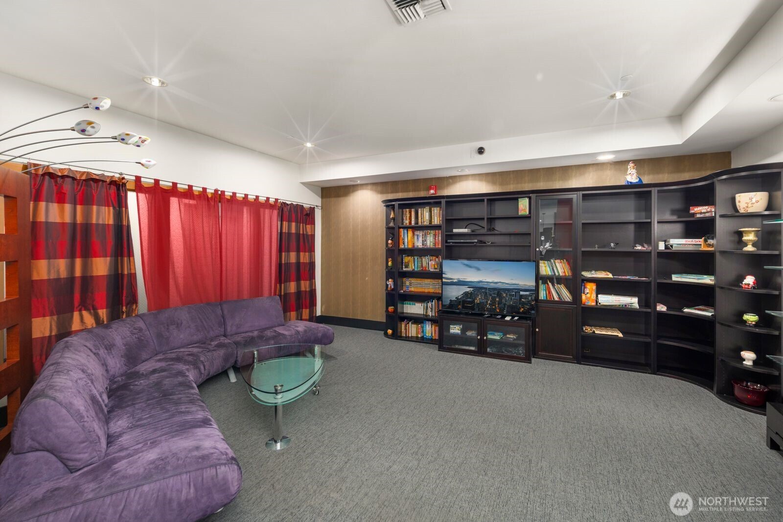 668 South Lane Street, Unit 314 Seattle, WA 98104 - Photo 25 of 36 a living room with furniture and gym equipment
