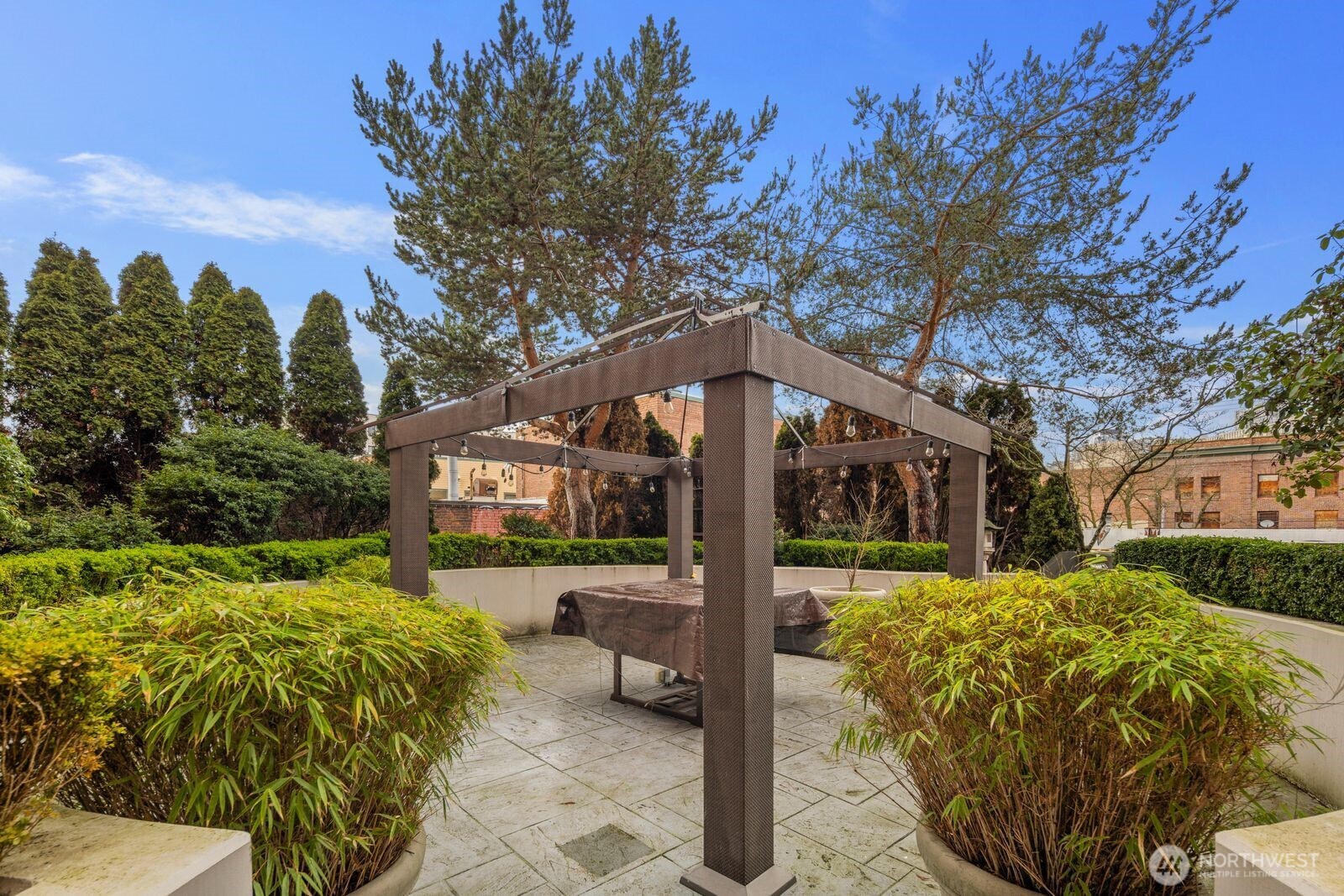 668 South Lane Street, Unit 314 Seattle, WA 98104 - Photo 28 of 36 a front view of a house with a yard table and chairs
