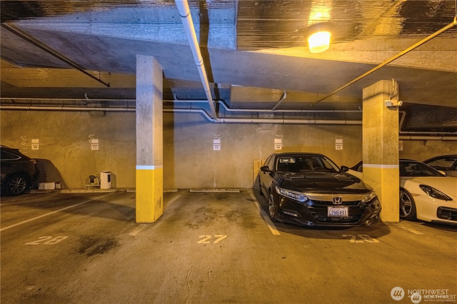 668 South Lane Street, Unit 314 Seattle, WA 98104 - Photo 30 of 36 a car parked in parking