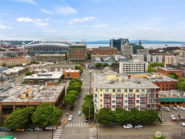 a view of city from balcony with yard