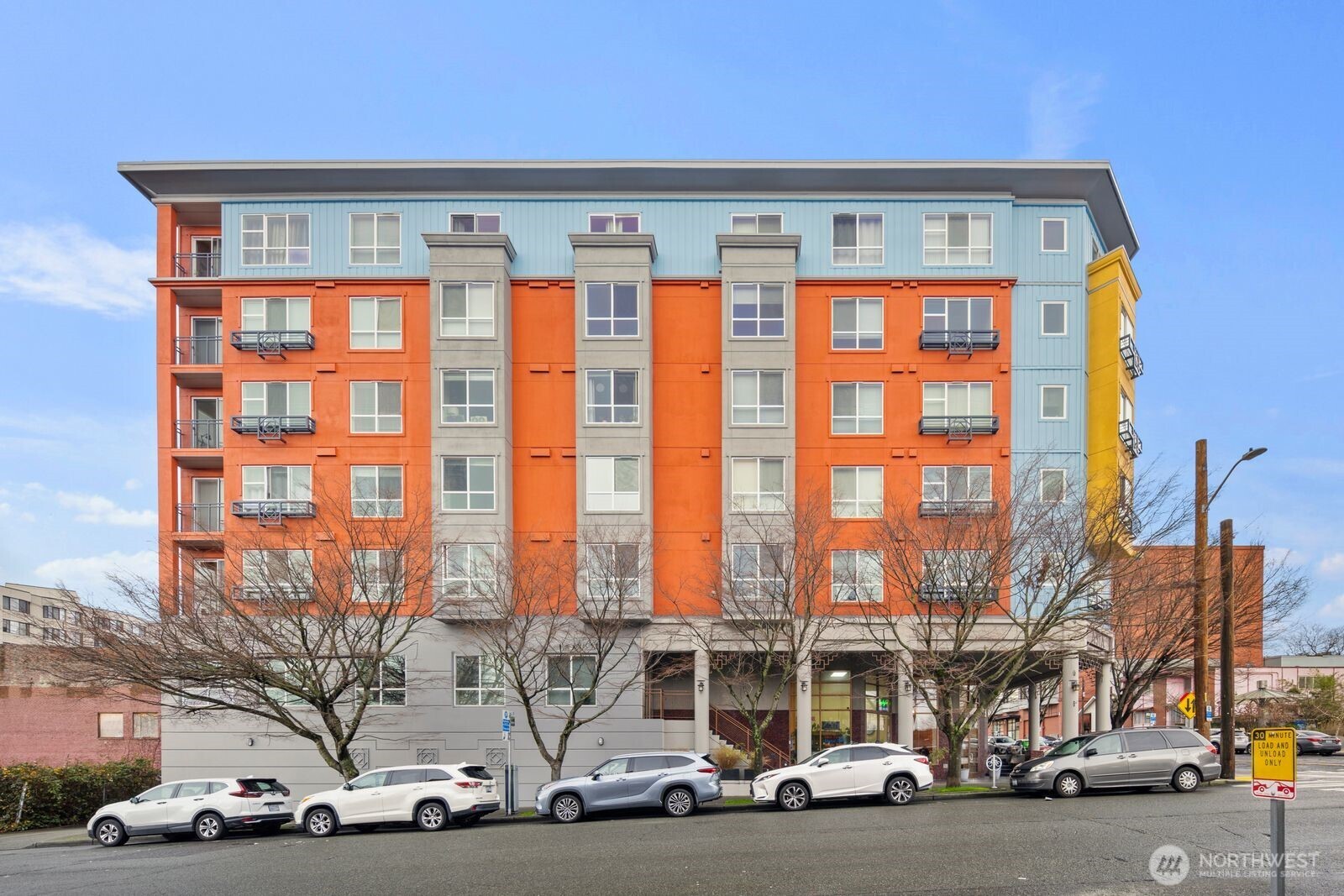 668 South Lane Street, Unit 314 Seattle, WA 98104 - Photo 34 of 36 a view of a cars parked in front of a building