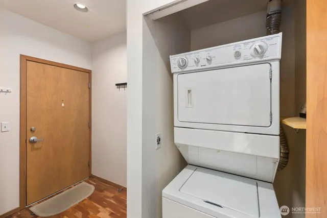 a view of a kitchen with granite countertop cabinets and wooden floor