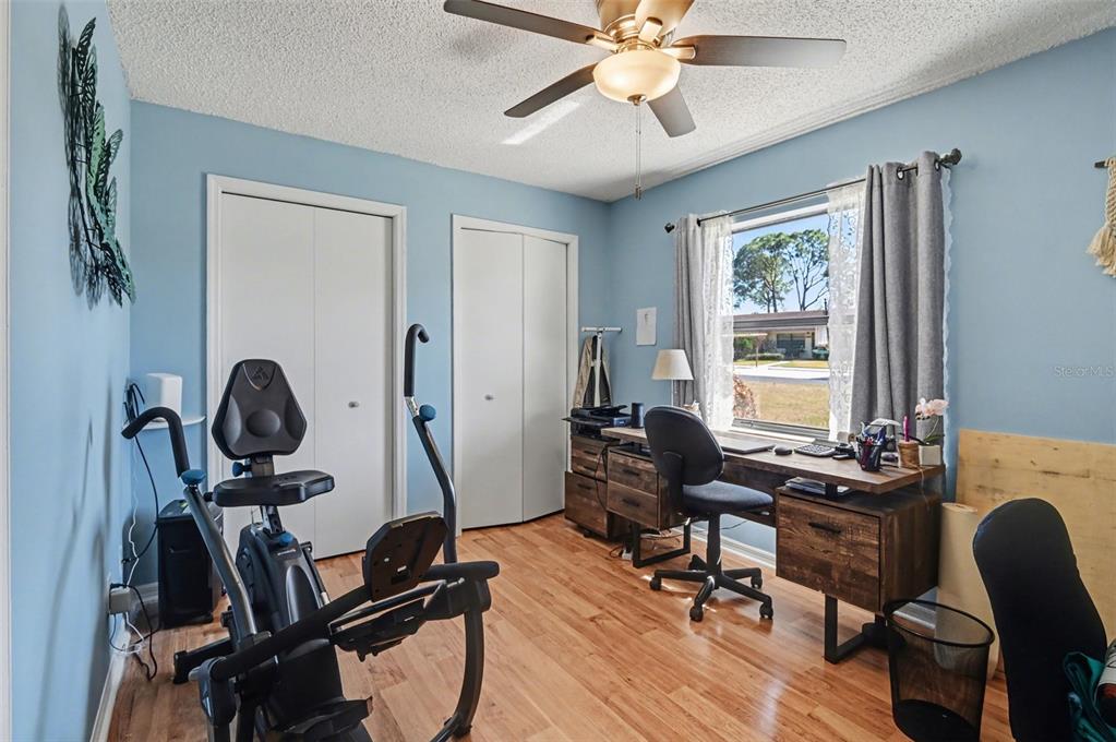 12435 Orangewood Circle Tavares, FL 32778 - Photo 23 of 30 a view of a workspace with furniture and a window