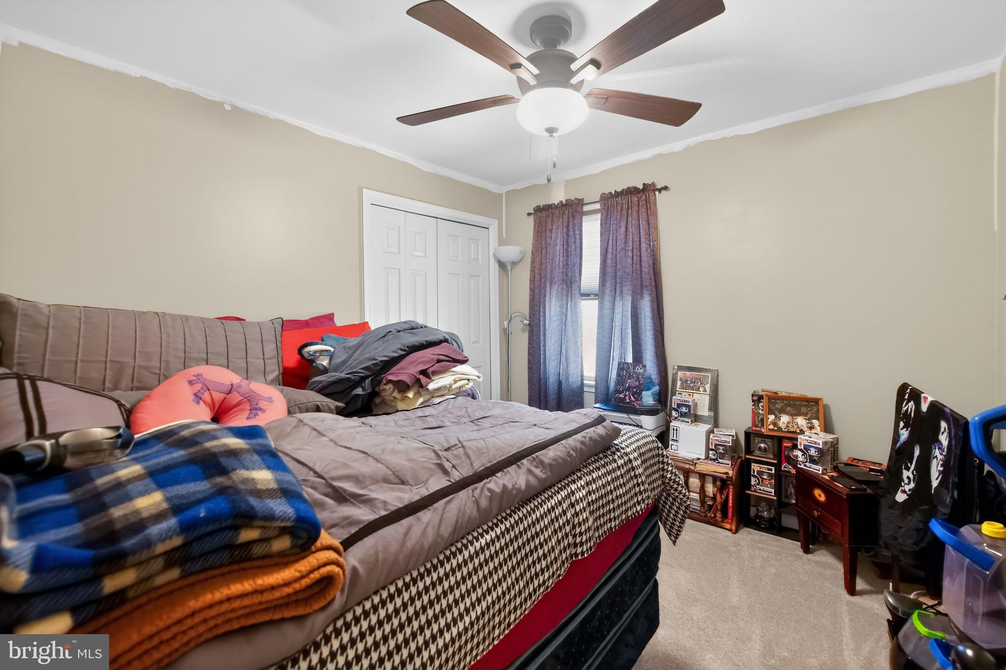 17006 Mt Savage Road Northwest Frostburg, MD 21532 - Photo 12 of 19 a bedroom with a bed and a chandelier