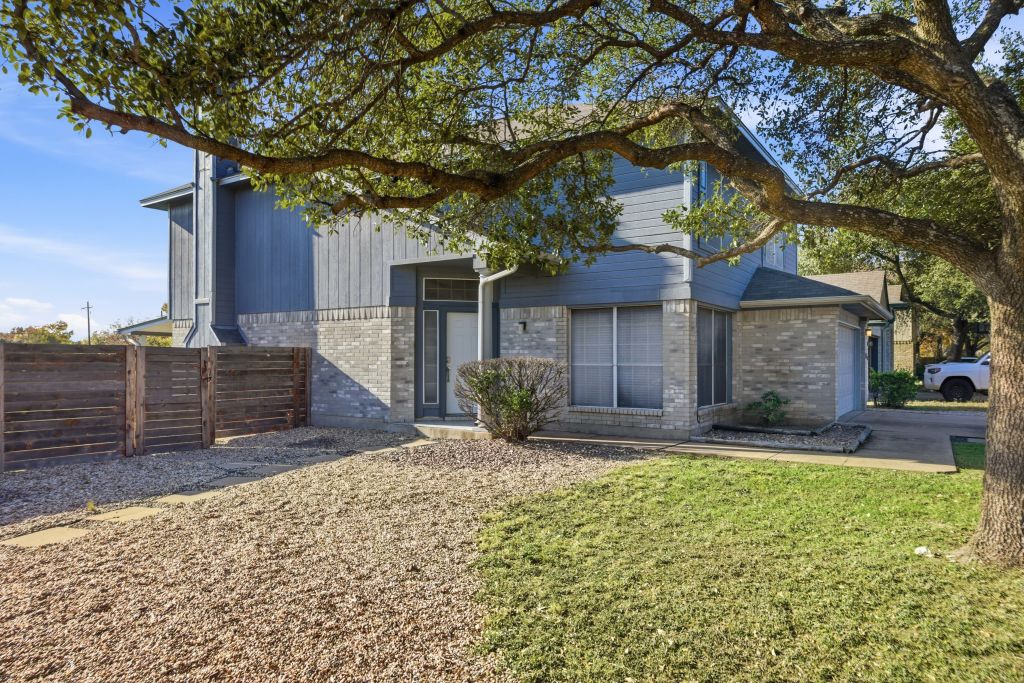 3201 Mocha Trail Austin, TX 78728 - Photo 2 of 26 a front view of a house with garden